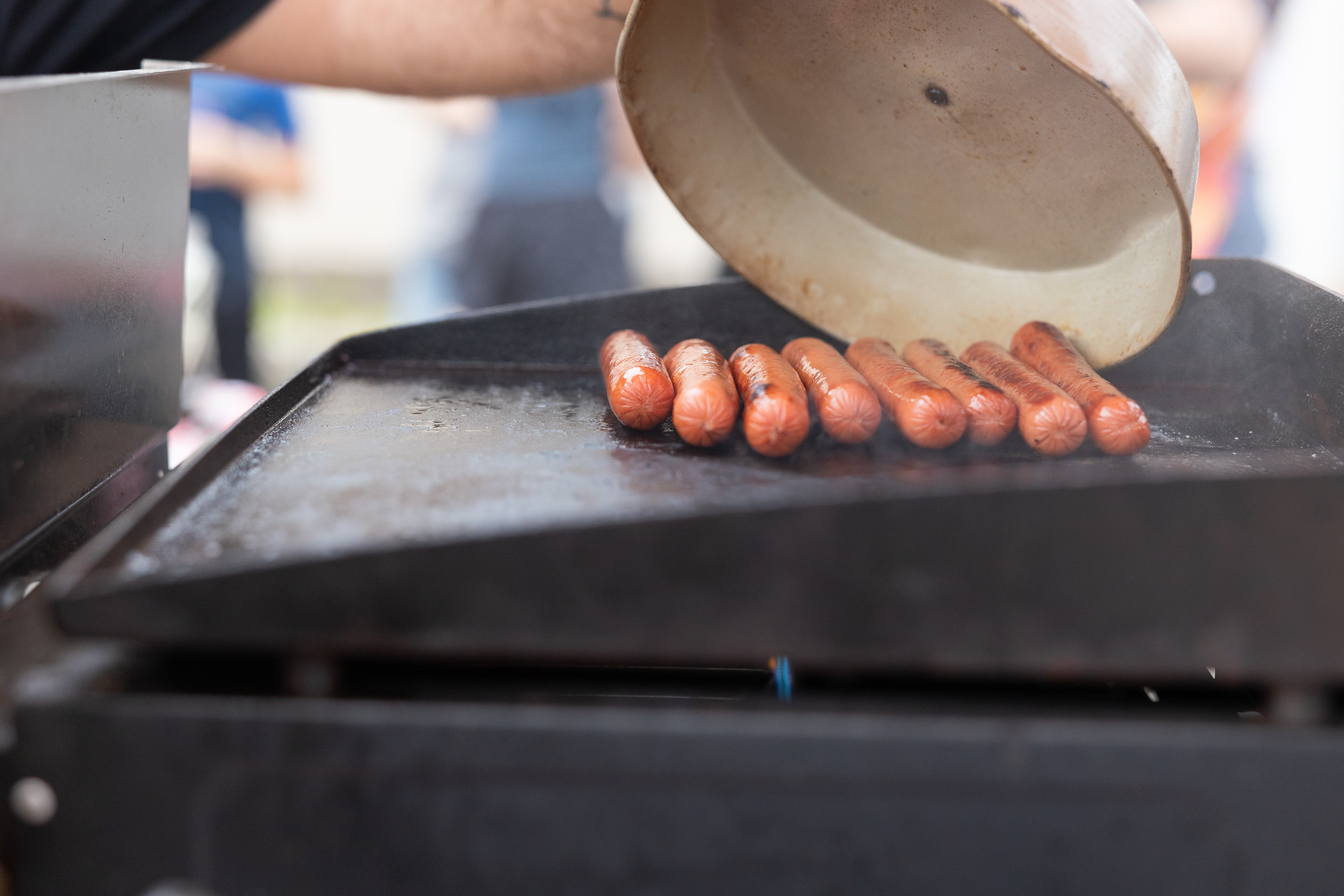 McDave serving from the hotdog cart